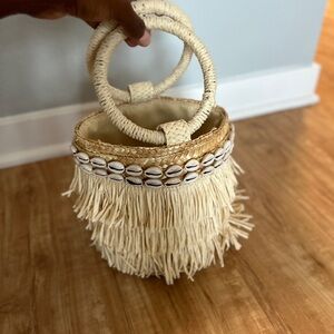 Straw purse with shells as accents.